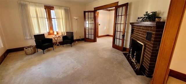 living area with a fireplace, baseboards, carpet flooring, and french doors