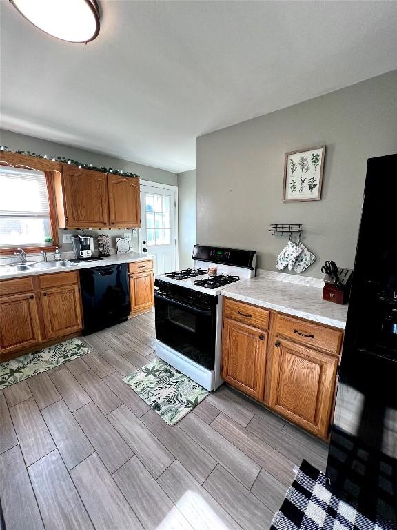 kitchen with black appliances and sink