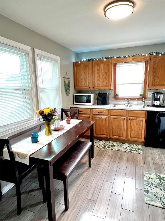 kitchen featuring sink and black dishwasher