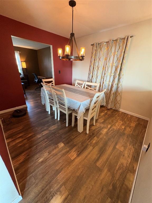4224 Amherst Rd, Millcreek, PA 16506 - dining room with wood finished floors and a chandelier