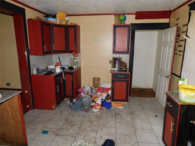 841 E 23rd St, Erie, PA 16503 - kitchen featuring crown molding and red cabinets