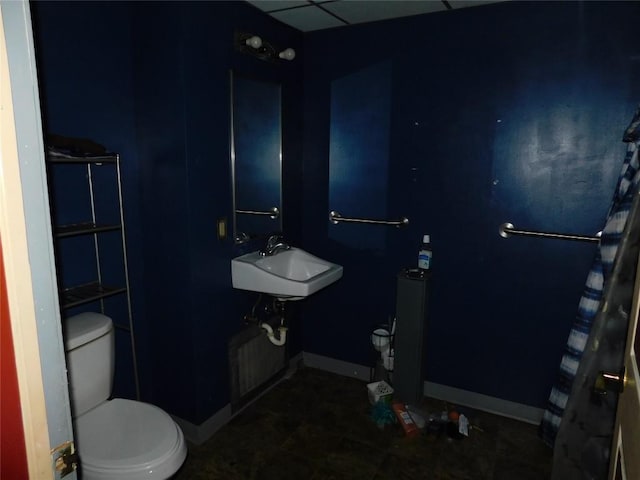 841 E 23rd St, Erie, PA 16503 - bathroom featuring a sink, toilet, and baseboards