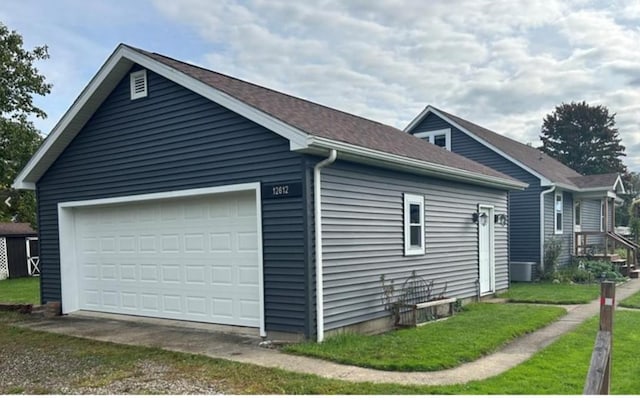 view of side of home with a garage