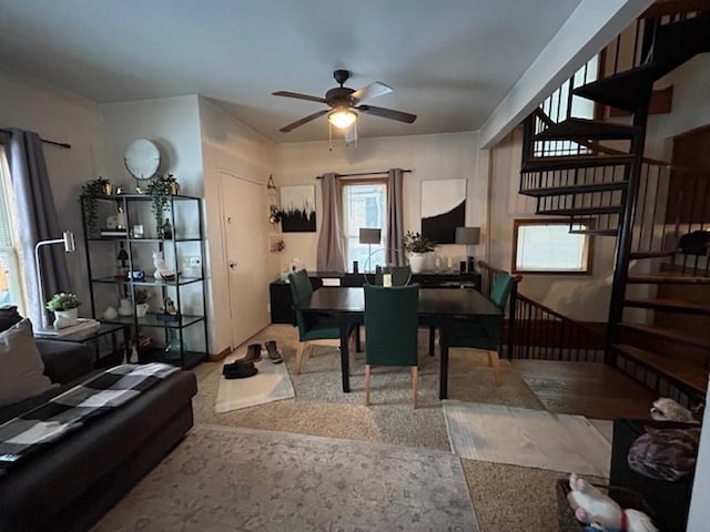 living room featuring carpet flooring and ceiling fan