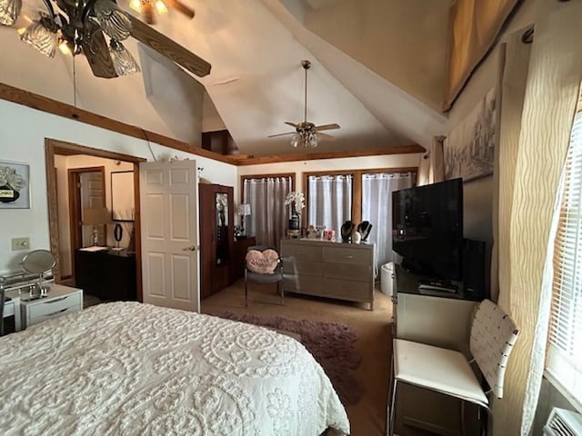 bedroom featuring ceiling fan, dark colored carpet, and lofted ceiling