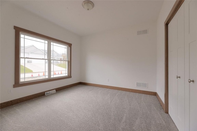 unfurnished bedroom featuring light colored carpet