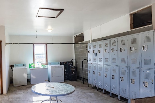 bathroom with concrete flooring and washer / clothes dryer