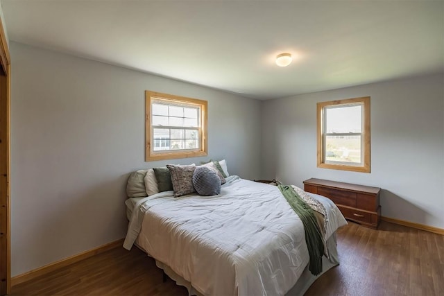 bedroom featuring dark wood-type flooring