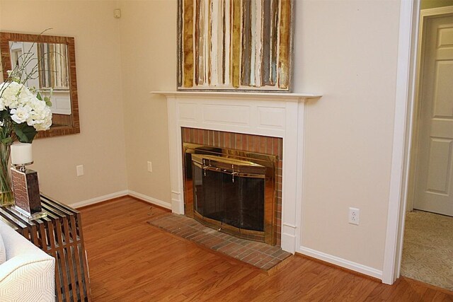 1351 Top Rd, Erie, PA 16505 - unfurnished living room with a brick fireplace and wood finished floors