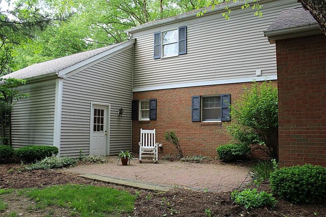 1351 Top Rd, Erie, PA 16505 - rear view of house with a patio area and brick siding