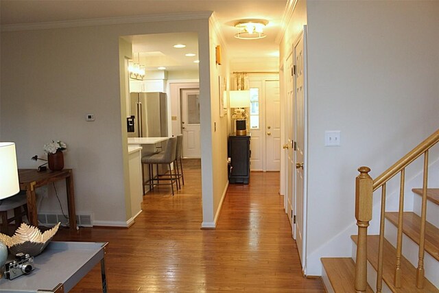1351 Top Rd, Erie, PA 16505 - hallway featuring hardwood / wood-style flooring, stairway, and crown molding