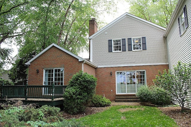 1351 Top Rd, Erie, PA 16505 - back of property featuring a chimney, brick siding, a wooden deck, and entry steps