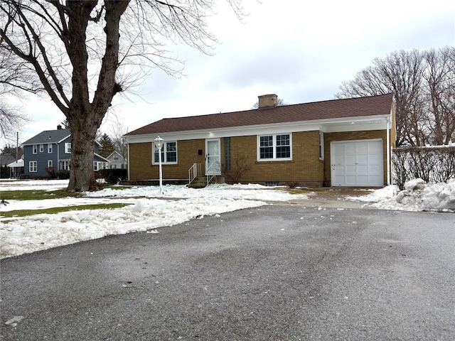 ranch-style house featuring a garage