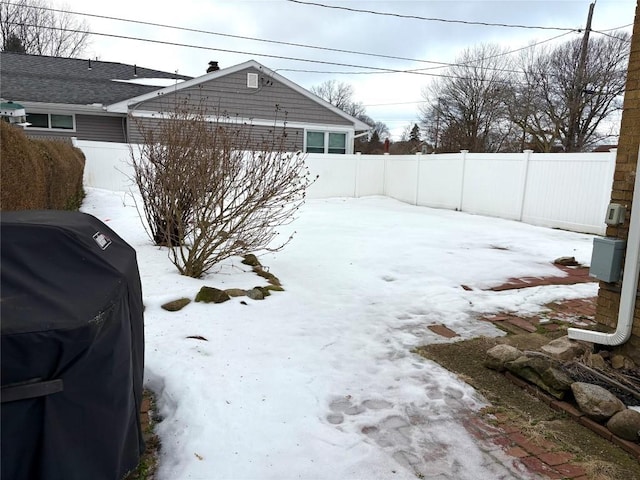 view of yard layered in snow