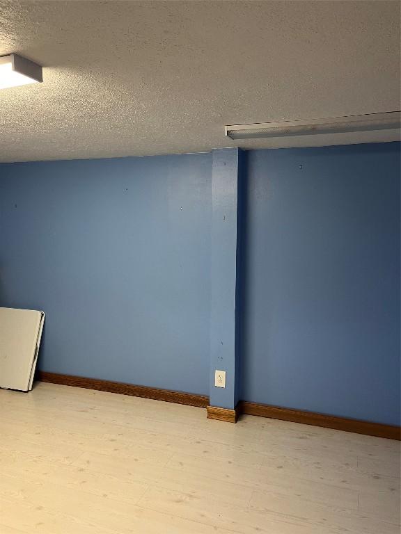 6915 Snodgrass Rd, Jamestown, PA 16134 - unfurnished room with a textured ceiling and baseboards