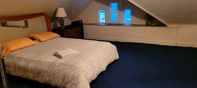 bedroom featuring lofted ceiling