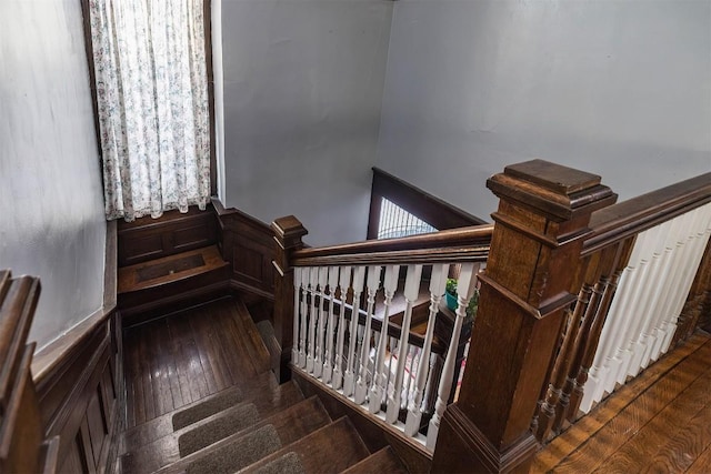 stairs with hardwood / wood-style flooring