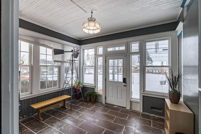 entryway featuring wood ceiling and ornamental molding