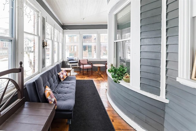 sunroom with lofted ceiling and wood ceiling