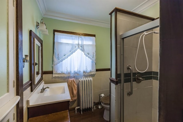 bathroom with crown molding, toilet, radiator heating unit, and walk in shower