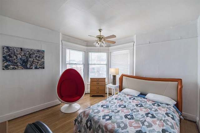 bedroom featuring hardwood / wood-style floors and ceiling fan