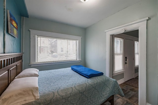 bedroom with hardwood / wood-style floors