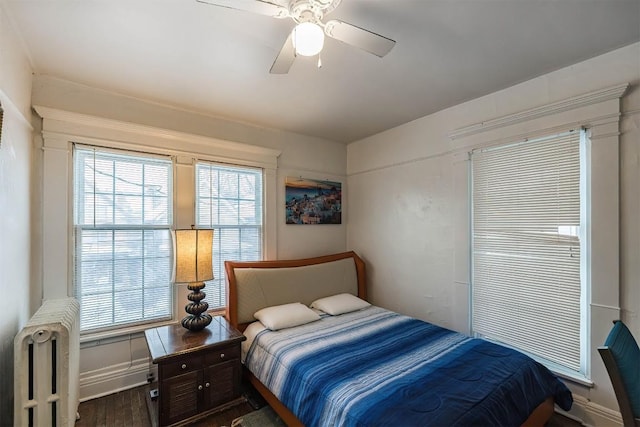 bedroom with hardwood / wood-style flooring and ceiling fan