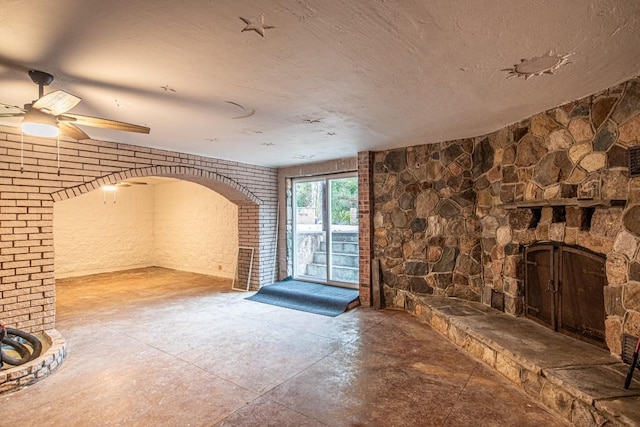 unfurnished living room featuring concrete flooring and ceiling fan