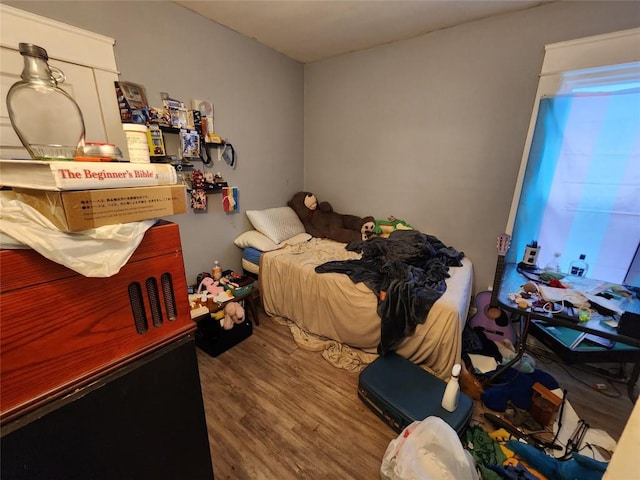 bedroom with wood finished floors