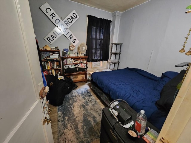 bedroom with wood finished floors