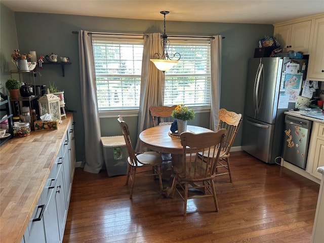 103 S Church St, Linesville, PA 16424 - dining space with dark wood finished floors and healthy amount of natural light