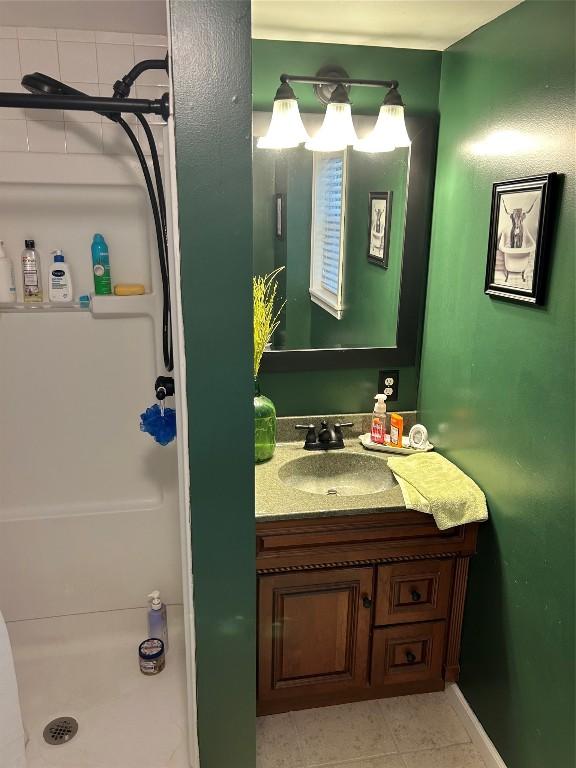 103 S Church St, Linesville, PA 16424 - bathroom featuring vanity and a shower stall