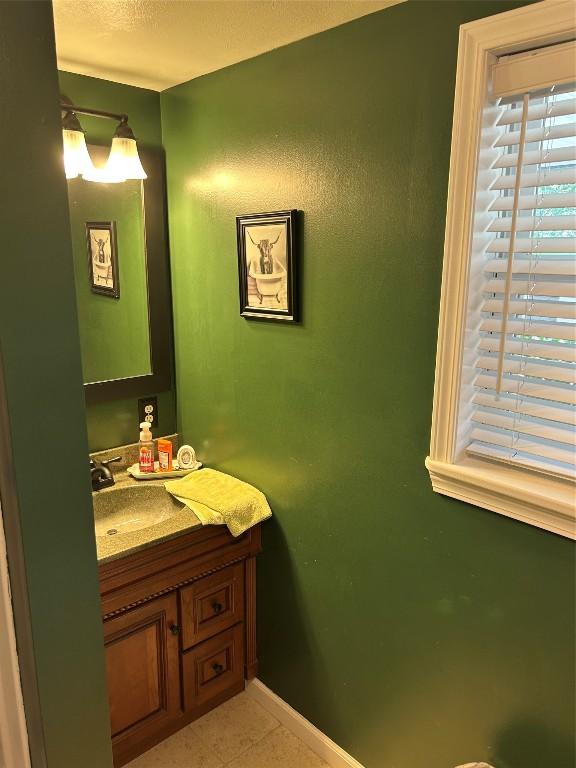 103 S Church St, Linesville, PA 16424 - bathroom featuring vanity and tile patterned flooring