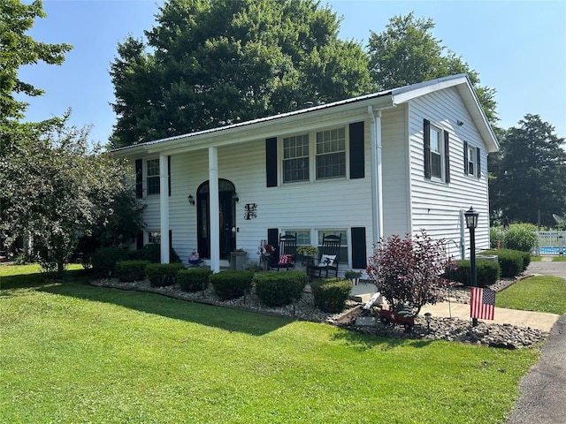 103 S Church St, Linesville, PA 16424 - raised ranch with a front lawn and a porch