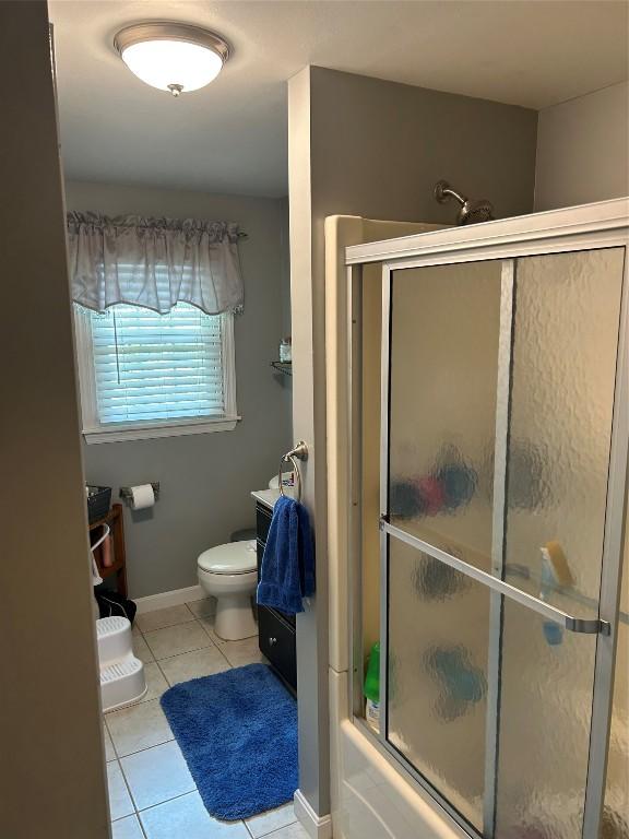 103 S Church St, Linesville, PA 16424 - full bathroom with tile patterned floors, bath / shower combo with glass door, and vanity