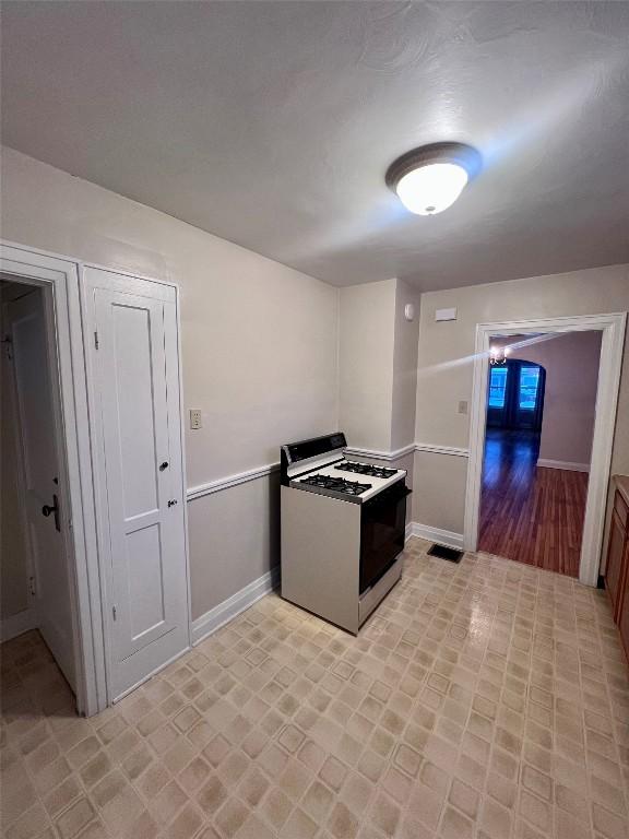 kitchen featuring white range