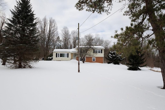 split level home featuring brick siding