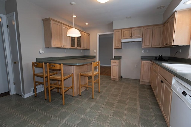 kitchen featuring visible vents, dark countertops, decorative light fixtures, white dishwasher, and recessed lighting