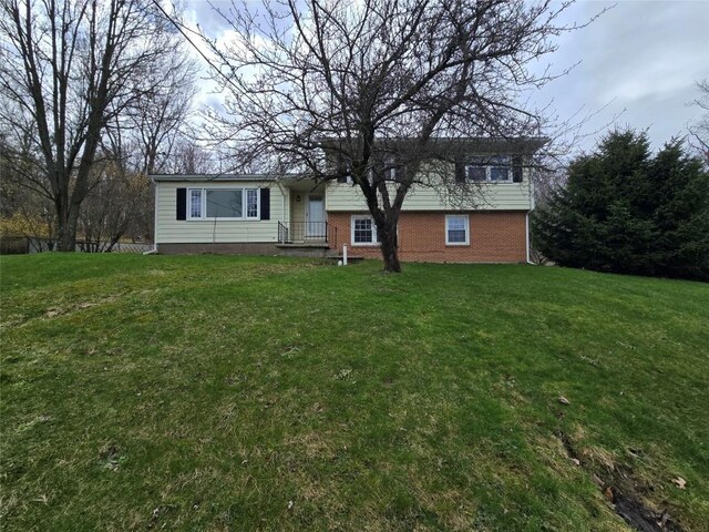 split level home featuring brick siding