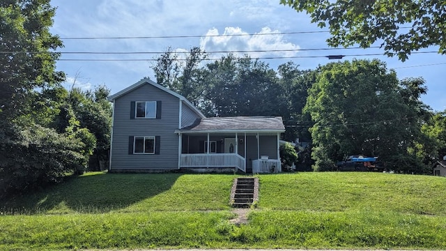 239 Marion St, Corry, PA 16407 - view of front of home featuring covered porch and a front yard