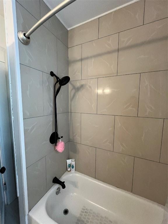 bathroom featuring  shower combination