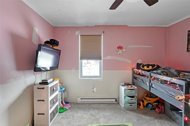 bedroom with baseboard heating, ceiling fan, and carpet floors