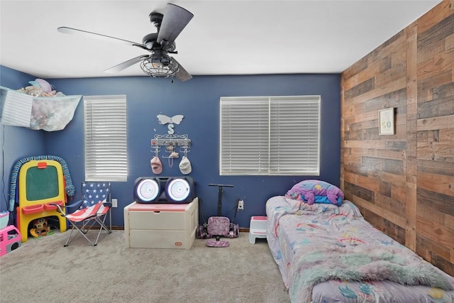 bedroom featuring ceiling fan and carpet