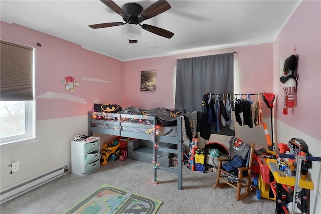 bedroom featuring ceiling fan, carpet flooring, and a baseboard heating unit