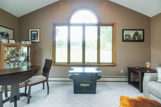 carpeted office space featuring a baseboard radiator, vaulted ceiling, and baseboards