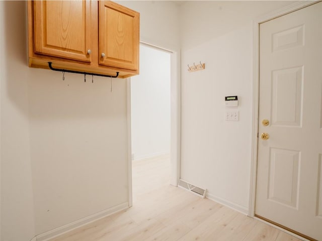 washroom with light hardwood / wood-style flooring