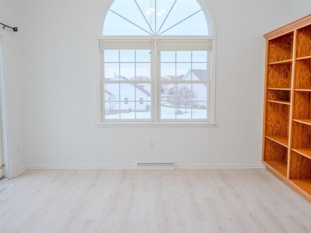 spare room with light hardwood / wood-style floors