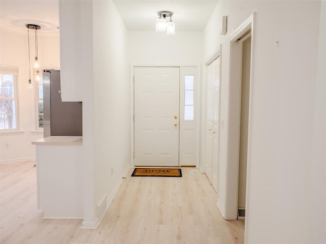 foyer entrance featuring light wood-type flooring