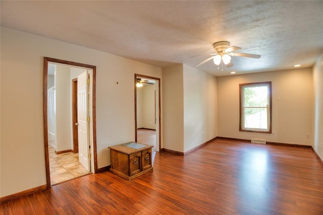 13151 Water Ext, Edinboro, PA 16412 - empty room featuring a ceiling fan, wood finished floors, and a textured ceiling