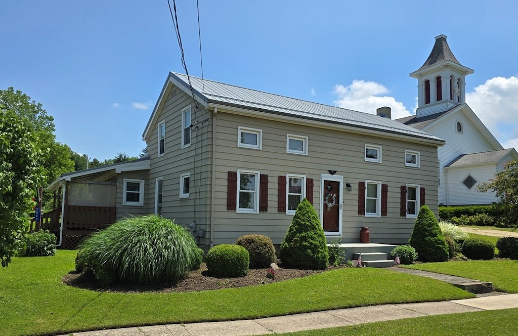 5023 N Main St, Mckean, PA 16426 - view of front of property with a front lawn, a metal roof, and a standing seam roof